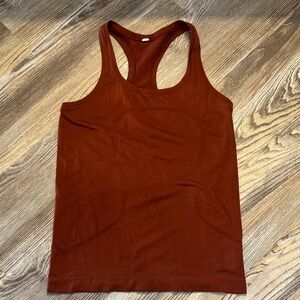 Lululemon Swifty Tech Hip length Tank Size 6 rust orange color